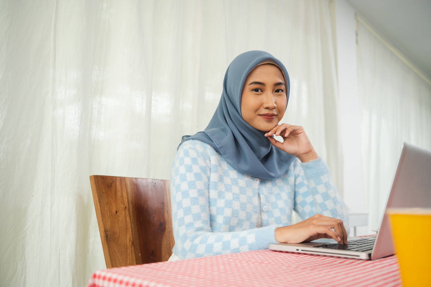 People of Indonesia Portrait of Woman Using a Laptop Indoors